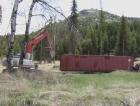 Dragging the shipping container across the upper meadow to the staging position